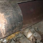 A hole cut by David Sweat into a disabled steam pipe leading through the prison's outer wall. (Office of General Services) 